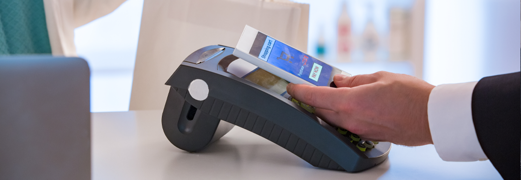 Someone using a digital gift card to purchase an item instore