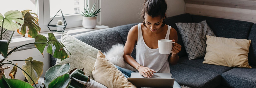 A Woman online shopping in the living room